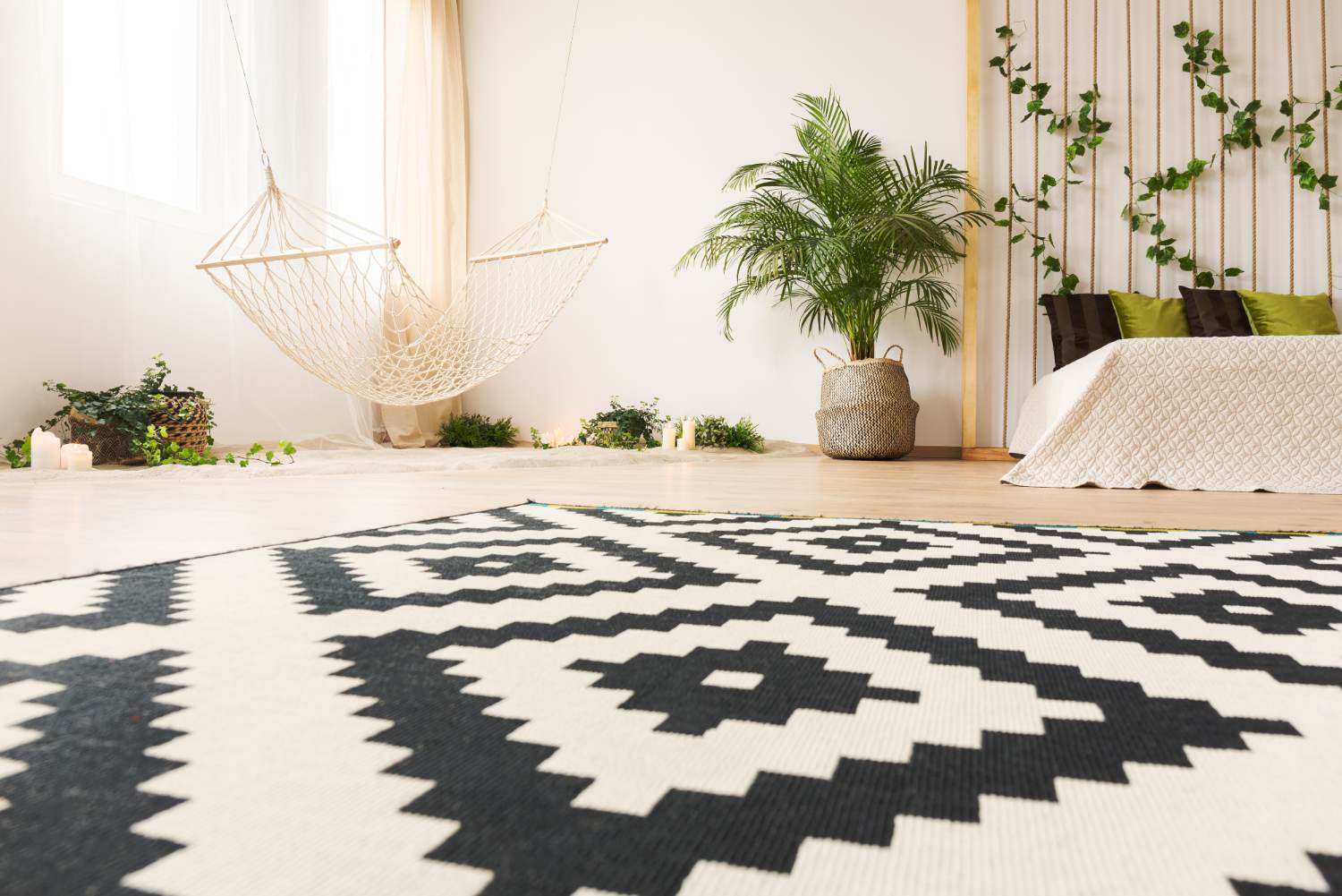 Modern living room with patterned machine washable rug beside white hammock